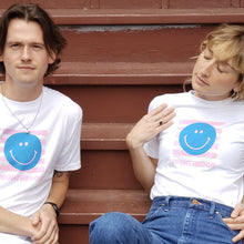 Load image into Gallery viewer, Night Heron Smiley T in white on man and woman
